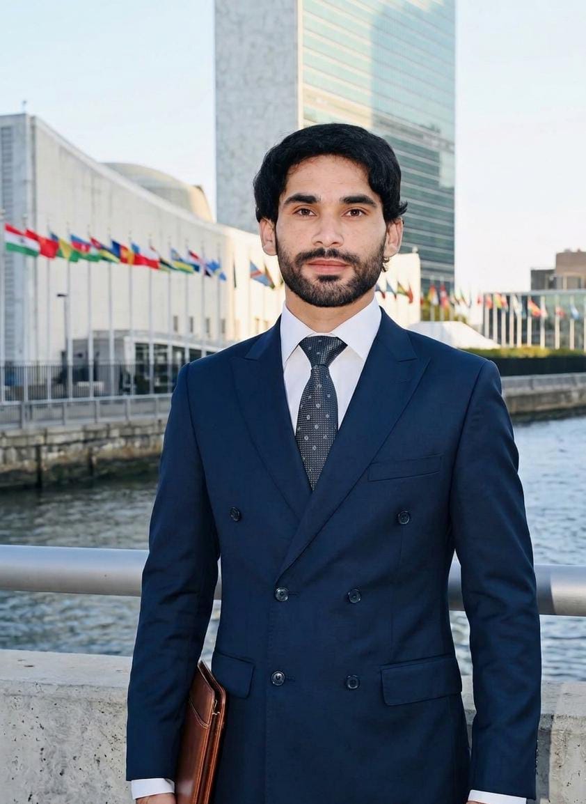 Muqaddas Ali standing before the United Nations headquarters in New York